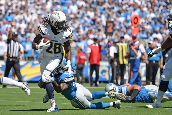 Sep 13, 2015; San Diego, CA, USA; San Diego Chargers running back Melvin Gordon (28) is defended by Detroit Lions linebacker Josh Bynes (57) during the first quarter at Qualcomm Stadium. Mandatory Credit: Jake Roth-USA TODAY Sports