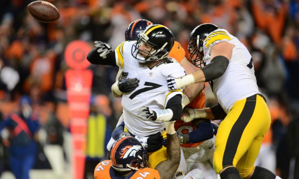 Jan 17, 2016; Denver, CO, USA; Pittsburgh Steelers quarterback Ben Roethlisberger (7) fumbles the ball in the fourth quarter during the AFC Divisional round playoff game at Sports Authority Field at Mile High. Mandatory Credit: Ron Chenoy-USA TODAY Sports