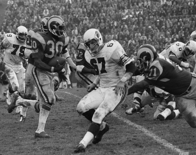 Los Angeles Rams running back Lawrence McCutcheon (30) runs upfield during a 1975 NFC Divisional Playoff Game against the St. Louis Cardinals in Los Angeles, Dec. 27, 1975. The Rams defeated the Cardinals 35-23. (AP Photo/NFL Photos)