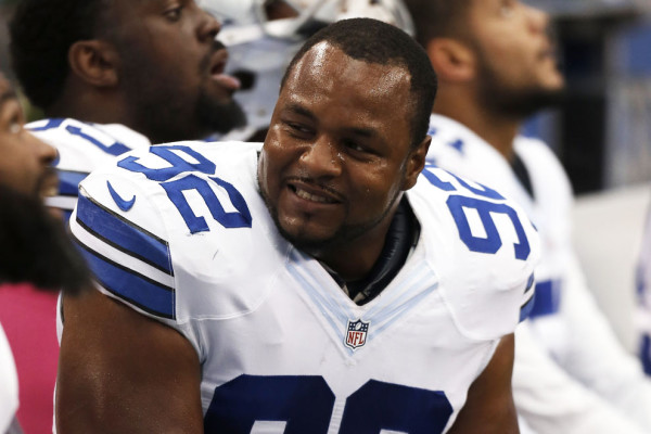 In this Oct. 5, 2014 file photo, Dallas Cowboys defensive end Jeremy Mincey sits on the bench during an NFL football game against the Houston Texans, in Arlington, Texas. Mincey came to Dallas as the "old man" on the defensive line after an unhappy ending in Jacksonville, where he grew up as an NFL player. He's still looking forward to seeing and playing against some old friends in London, though. (AP Photo/Brandon Wade, File)