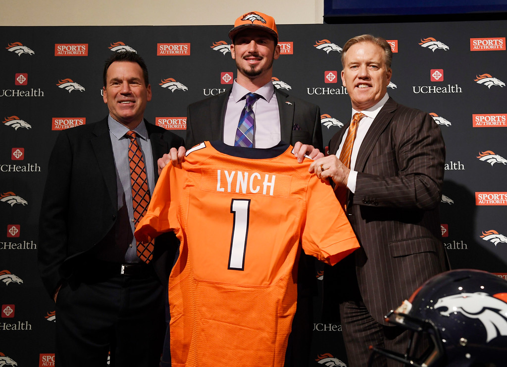 Denver Broncos head coach Gary Kubiak and executive vice president John Elway pose with first round pick QB Paxton Lynch during Lynch's introductory press conference at Broncos headquarters April 29, 2016. (Photo by Andy Cross/The Denver Post)