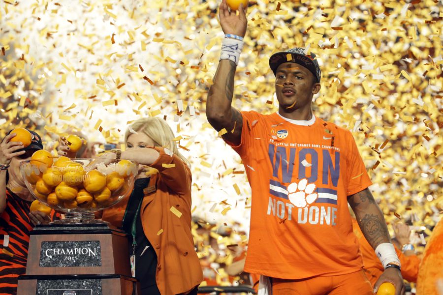 Clemson quarterback Deshaun Watson (4) throws oranges to the crowd after his team won the Orange Bowl NCAA college football semifinal playoff game against Oklahoma, Thursday, Dec. 31, 2015, in Miami Gardens, Fla. Clemson defeated Oklahoma 37-17. (AP Photo/Joe Skipper)