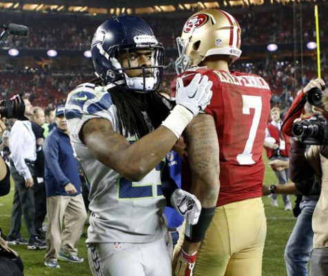 San Francisco 49ers' quarterback Colin Kaepernick (7) is tapped on the back by the Seattle Seahawks' Richard Sherman (25) as they leave the field after a 19-3 Seattle win at Levi's Stadium in Santa Clara, Calif., on Thursday, Nov. 27, 2014. (Josie Lepe/Bay Area News Group)
