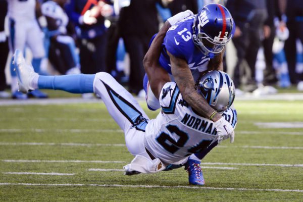 FILE - In this Dec. 20, 2015, file phoo, New York Giants wide receiver Odell Beckham (13) and Carolina Panthers' Josh Norman (24) grapple during the first half of an NFL football game in East Rutherford, N.J. In response to the season's violent outbursts by Giants receiver Odell Beckham Jr., Bengals linebacker Vontaze Burfict and others, NFL Commissioner Roger Goodell suggested a rule might be passed that would call for an automatic ejection if a player receives two personal fouls in a game. (AP Photo/Julie Jacobson, File) ORG XMIT: NY159